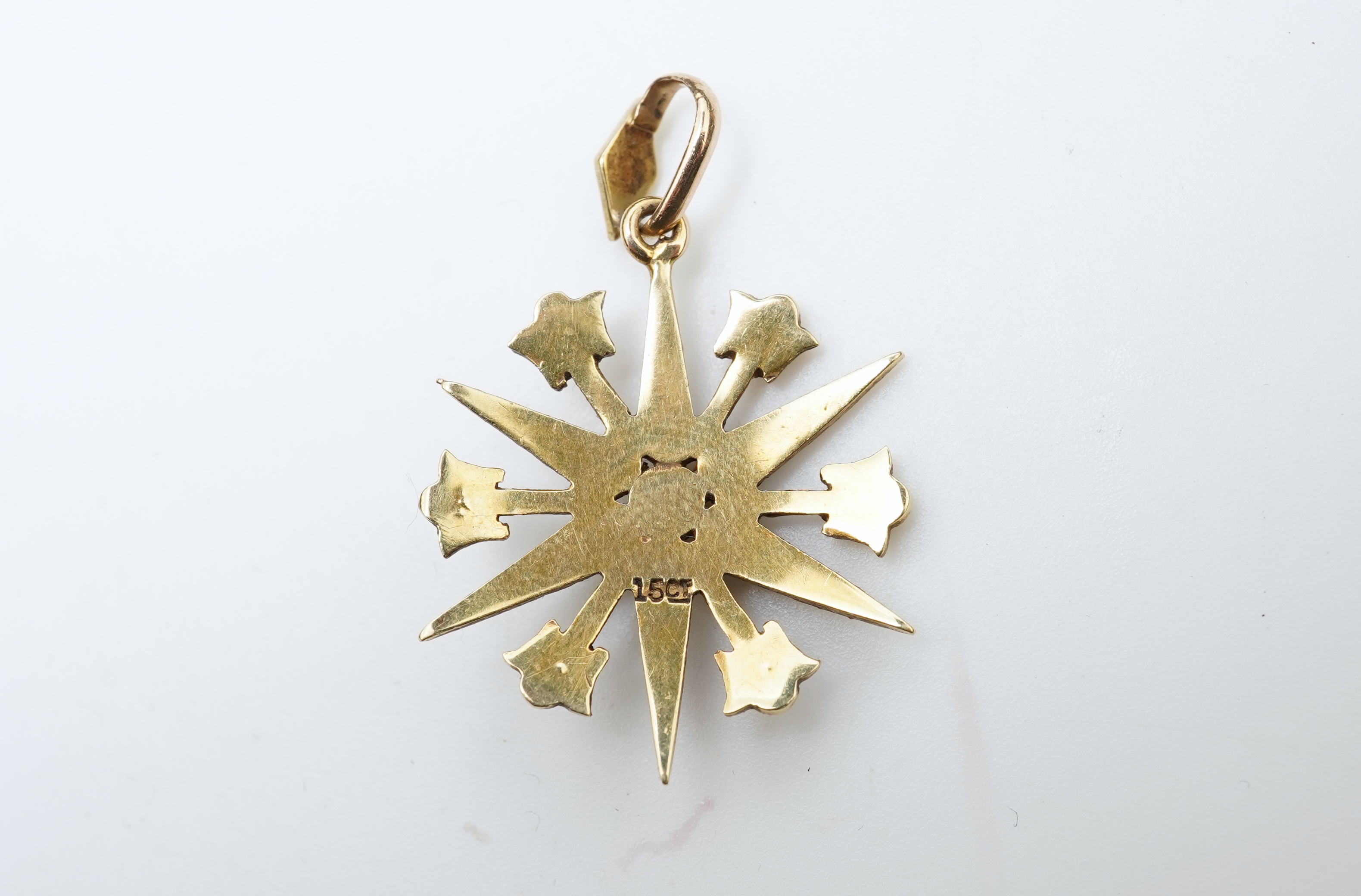 A gem-set egg pendant and an Edwardian seed pearl pendant